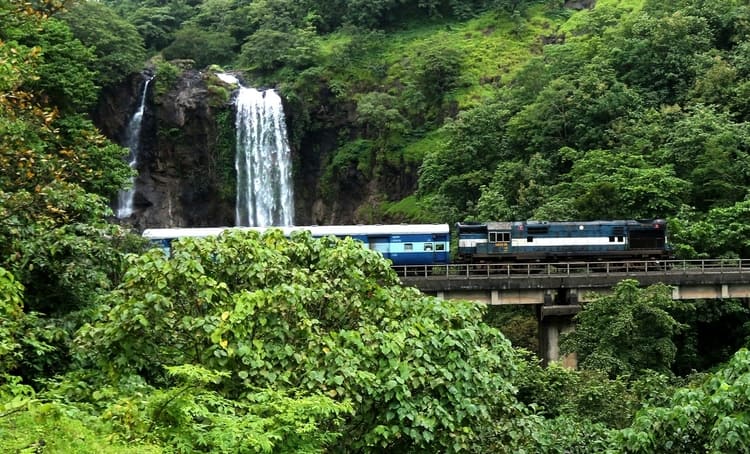 Train crossing waterfall